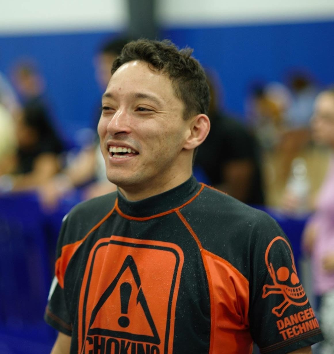 Professor Carlos smiling at a jiu-jitsu event
