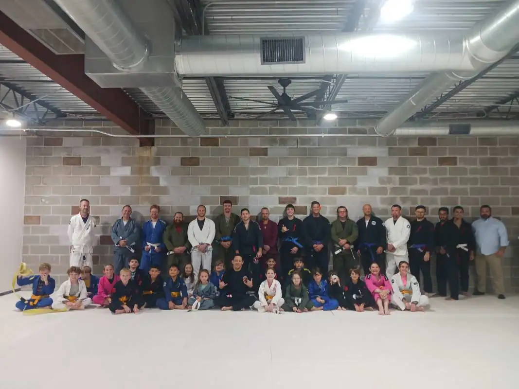 The Come See Me On The Mat academy community together on the mats